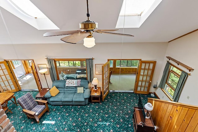176 Perkins Beach Rd, Wayne, ME 04284 - living area featuring a skylight, vaulted ceiling, carpet flooring, and ceiling fan