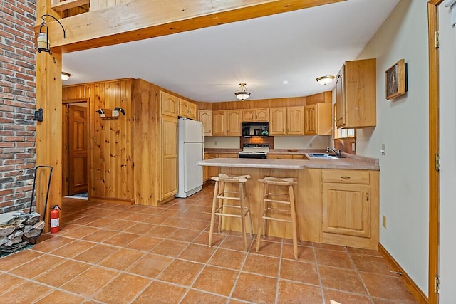 176 Perkins Beach Rd, Wayne, ME 04284 - kitchen with freestanding refrigerator, black microwave, electric range oven, a peninsula, and light countertops