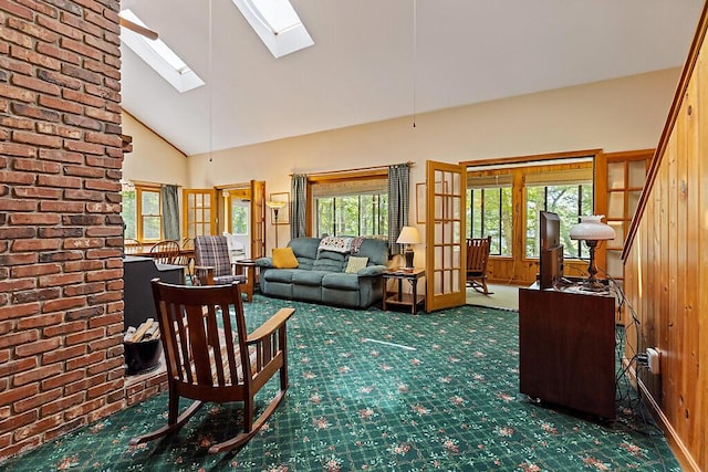 176 Perkins Beach Rd, Wayne, ME 04284 - carpeted living area featuring a skylight and high vaulted ceiling
