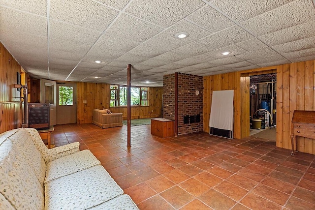 176 Perkins Beach Rd, Wayne, ME 04284 - unfurnished living room with wooden walls, tile patterned flooring, and recessed lighting