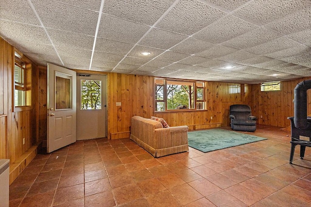 176 Perkins Beach Rd, Wayne, ME 04284 - living area with a wood stove and wooden walls