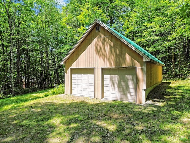 176 Perkins Beach Rd, Wayne, ME 04284 - detached garage with a wooded view