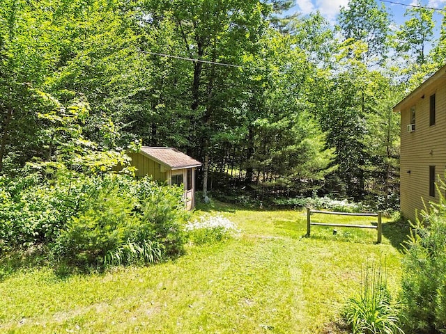 176 Perkins Beach Rd, Wayne, ME 04284 - view of green lawn featuring an outdoor structure
