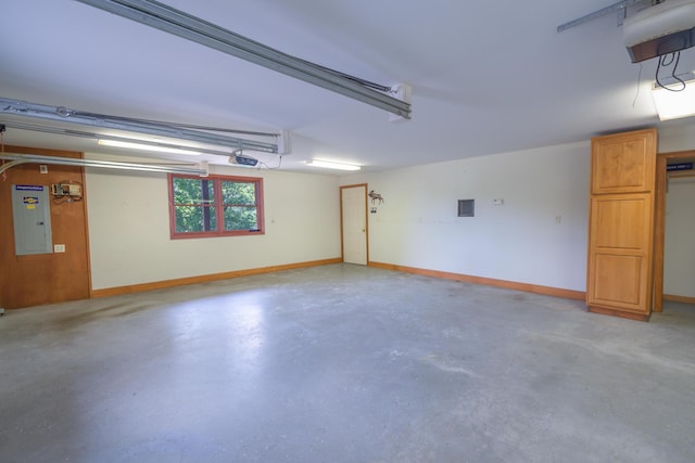 30 Hillside Dr, Kingfield, ME 04947 - garage with a garage door opener and electric panel