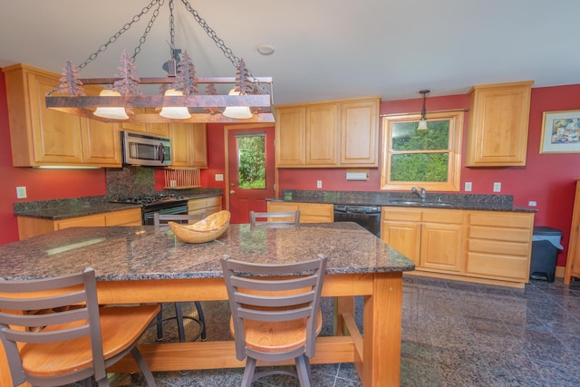 30 Hillside Dr, Kingfield, ME 04947 - kitchen featuring black appliances, light brown cabinets, a breakfast bar area, a kitchen island, and backsplash