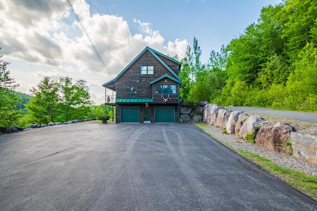 30 Hillside Dr, Kingfield, ME 04947 - view of side of property with a garage, driveway, and a metal roof
