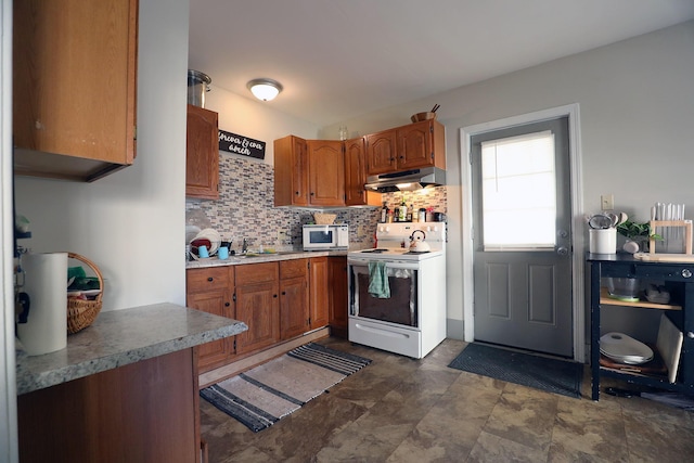 41 Dunn St, Auburn, ME 04210 - kitchen featuring white appliances, under cabinet range hood, tasteful backsplash, and brown cabinets