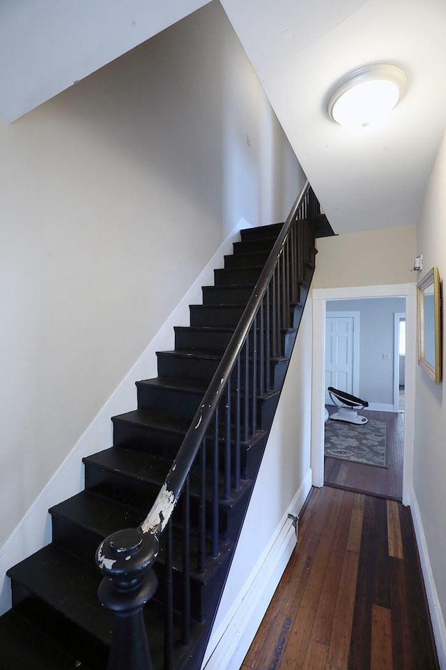 41 Dunn St, Auburn, ME 04210 - stairway featuring hardwood / wood-style flooring and baseboards