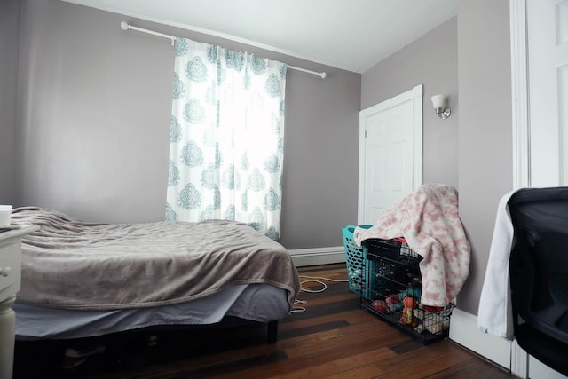 41 Dunn St, Auburn, ME 04210 - bedroom featuring wood finished floors and baseboard heating