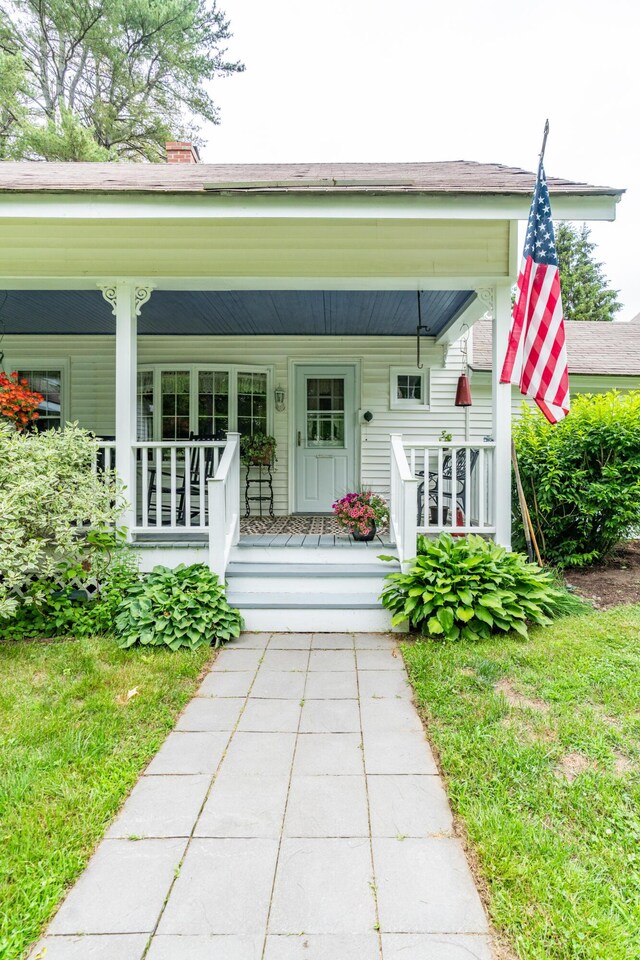 22 River Rd, Dresden, ME 04342 - doorway to property featuring a porch