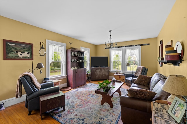22 River Rd, Dresden, ME 04342 - living area featuring wood-type flooring and a chandelier