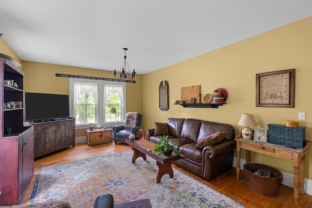 22 River Rd, Dresden, ME 04342 - living room with hardwood / wood-style floors and a chandelier