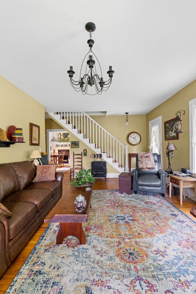 22 River Rd, Dresden, ME 04342 - living room with stairs, a chandelier, and wood finished floors