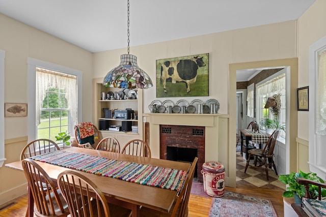 22 River Rd, Dresden, ME 04342 - dining room with a fireplace and wood finished floors