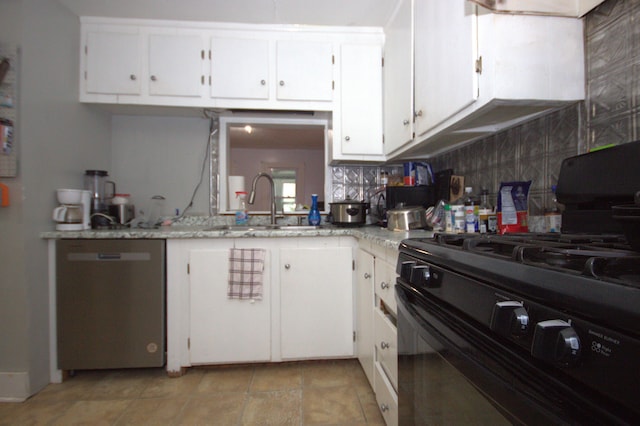 30 Burnham St, Old Town, ME 04468 - kitchen with black range with gas stovetop, stainless steel dishwasher, white cabinets, tasteful backsplash, and light stone counters