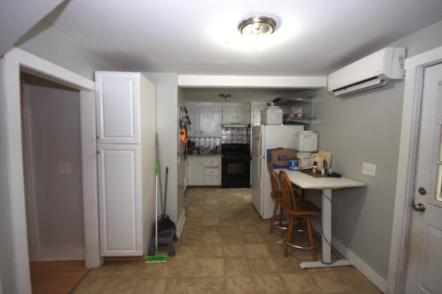 30 Burnham St, Old Town, ME 04468 - kitchen with a wall mounted air conditioner, range, backsplash, freestanding refrigerator, and under cabinet range hood