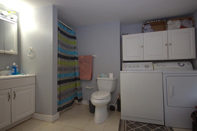30 Burnham St, Old Town, ME 04468 - bathroom featuring independent washer and dryer, vanity, tile patterned flooring, and a shower with shower curtain