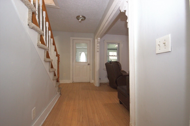 30 Burnham St, Old Town, ME 04468 - entryway with stairs, light wood finished floors, and a textured ceiling