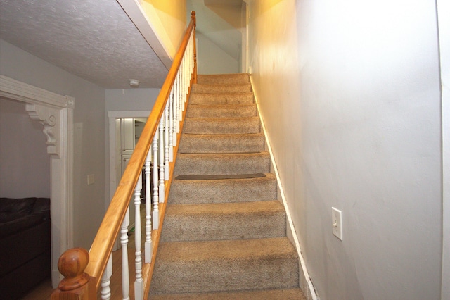 30 Burnham St, Old Town, ME 04468 - stairs featuring carpet floors and a textured ceiling