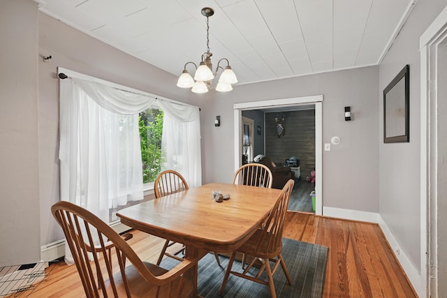 2 Clark St, Randolph, ME 04346 - dining area with light wood-style floors and a chandelier