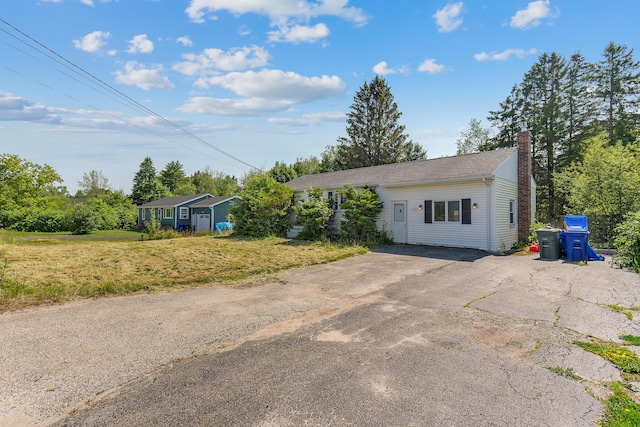 911 Spring St, Westbrook, ME 04092 - single story home with a chimney and a front lawn