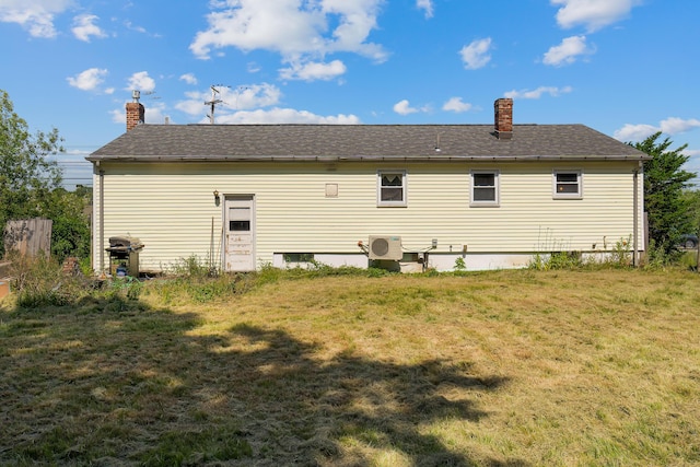 911 Spring St, Westbrook, ME 04092 - rear view of property with a lawn and a chimney