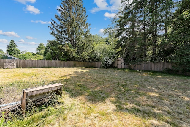 911 Spring St, Westbrook, ME 04092 - fenced backyard featuring a storage unit