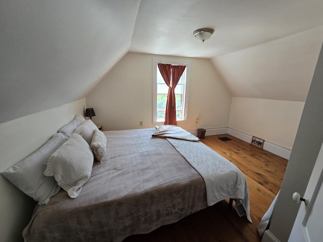 314 River Rd, Orrington, ME 04474 - bedroom featuring wood finished floors and vaulted ceiling