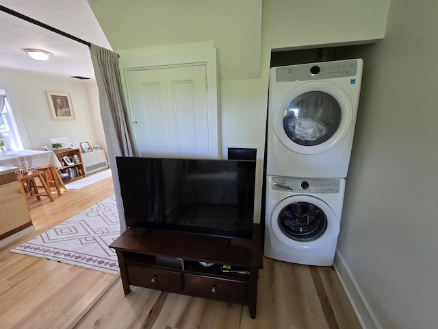 314 River Rd, Orrington, ME 04474 - washroom with stacked washer / dryer and light wood-style flooring