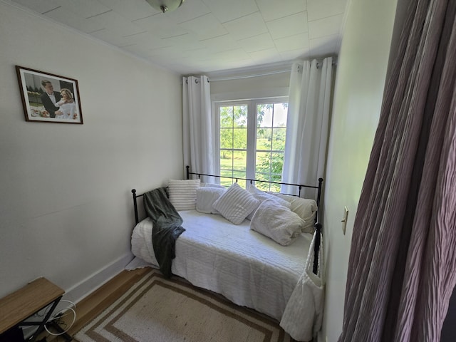 314 River Rd, Orrington, ME 04474 - bedroom featuring ornamental molding and wood finished floors