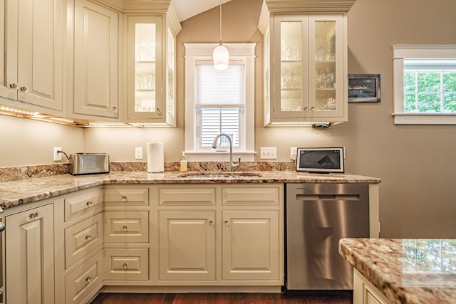 375 Pride St Unit 15, Westbrook, ME 04092 - kitchen featuring stainless steel dishwasher, light stone countertops, pendant lighting, and glass insert cabinets