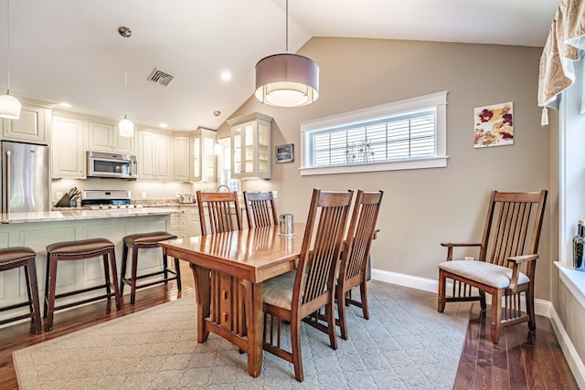 375 Pride St Unit 15, Westbrook, ME 04092 - dining area with wood finished floors, vaulted ceiling, and recessed lighting