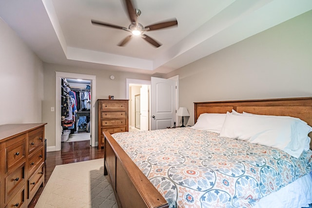 375 Pride St Unit 15, Westbrook, ME 04092 - bedroom with a raised ceiling, a walk in closet, a closet, and ceiling fan