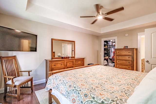 375 Pride St Unit 15, Westbrook, ME 04092 - bedroom featuring a tray ceiling, wood finished floors, a spacious closet, a closet, and a ceiling fan
