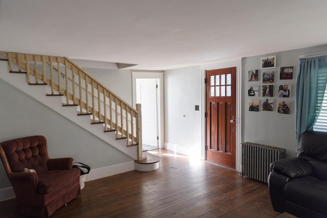 55 Ossipee Trl E, Standish, ME 04084 - foyer with radiator, wood finished floors, and stairway
