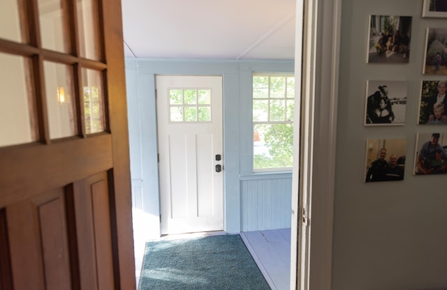 55 Ossipee Trl E, Standish, ME 04084 - doorway to outside featuring carpet floors and ornamental molding