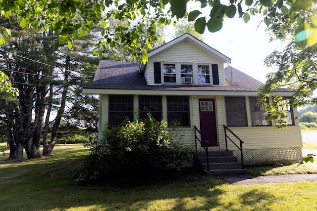 55 Ossipee Trl E, Standish, ME 04084 - bungalow-style house featuring entry steps, roof with shingles, and a front lawn