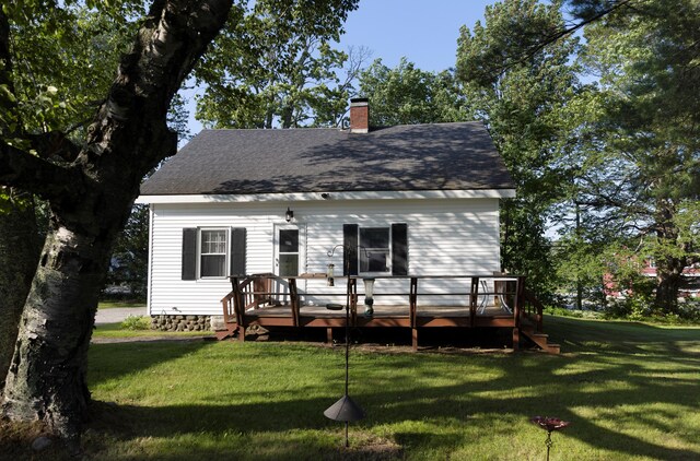 55 Ossipee Trl E, Standish, ME 04084 - rear view of property with a yard, a wooden deck, a chimney, and a shingled roof
