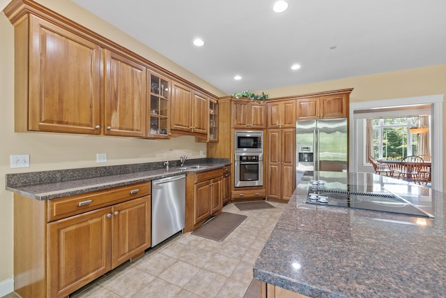 2 Summit Ln, Raymond, ME 04071 - kitchen with stainless steel appliances, brown cabinetry, glass insert cabinets, recessed lighting, and light tile patterned floors