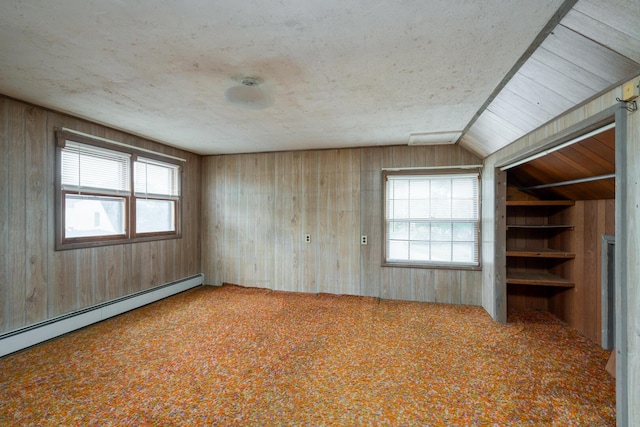 4 Sterling Rd, Kittery, ME 03904 - carpeted empty room featuring a baseboard radiator and wooden walls