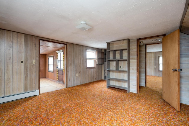 4 Sterling Rd, Kittery, ME 03904 - unfurnished room featuring wood walls, carpet, and a textured ceiling
