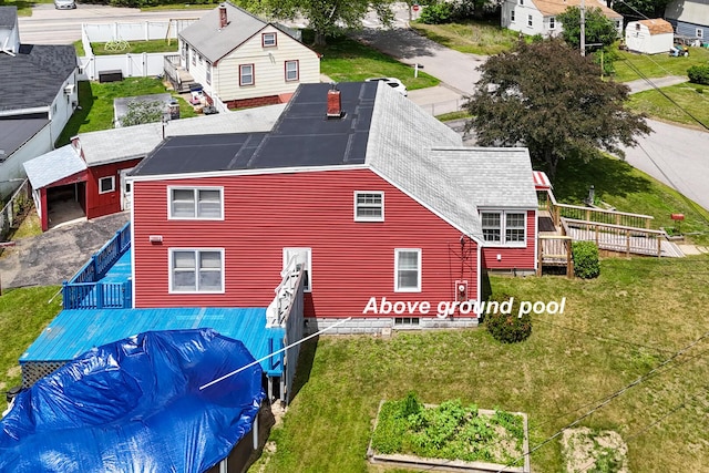 4 Sterling Rd, Kittery, ME 03904 - back of property with a shingled roof and a deck