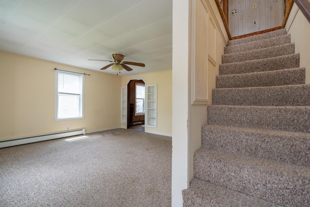 4 Sterling Rd, Kittery, ME 03904 - staircase featuring carpet floors, a baseboard radiator, ceiling fan, and arched walkways