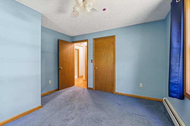 24 Maple Ridge Rd, Gorham, ME 04038 - unfurnished bedroom with baseboard heating, carpet floors, and ceiling fan
