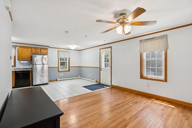 24 Maple Ridge Rd, Gorham, ME 04038 - unfurnished living room with ornamental molding, healthy amount of natural light, light wood-type flooring, and baseboard heating