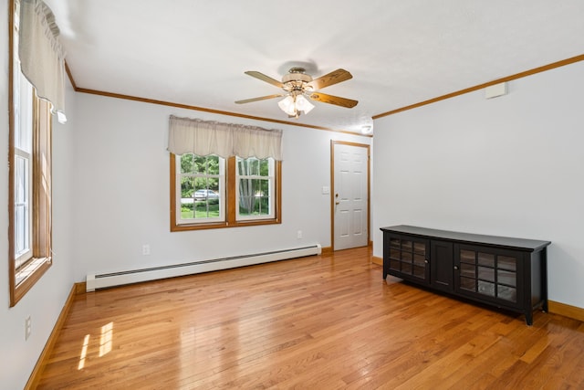 24 Maple Ridge Rd, Gorham, ME 04038 - spare room featuring a baseboard heating unit, crown molding, ceiling fan, and light wood-style flooring