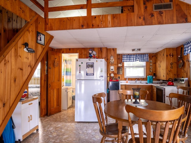 16 Hide Away Ln, Milton, NH 03851 - dining room with wood walls and a paneled ceiling