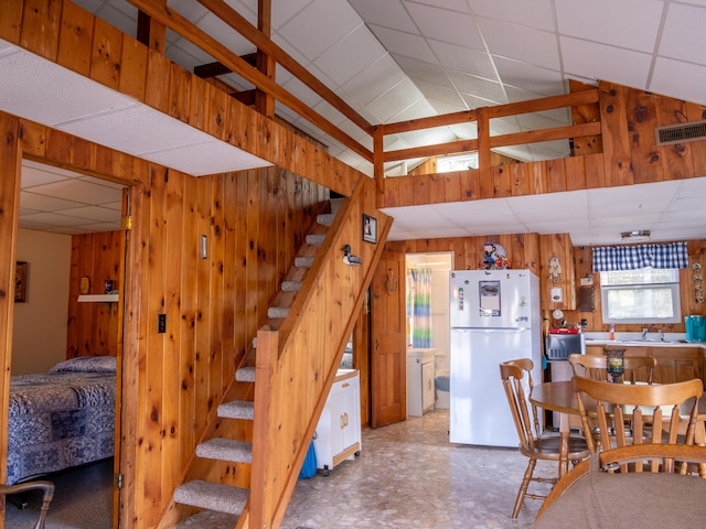 16 Hide Away Ln, Milton, NH 03851 - dining room with wood walls, a drop ceiling, stairway, and lofted ceiling
