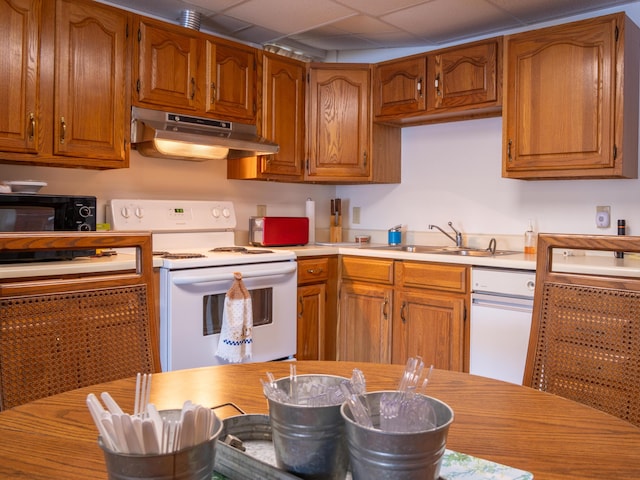 16 Hide Away Ln, Milton, NH 03851 - kitchen with electric range, under cabinet range hood, black microwave, light countertops, and brown cabinetry