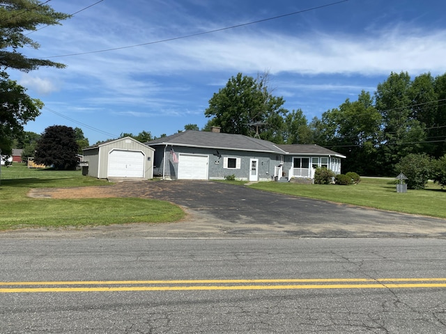 68 Stetson Rd, Newport, ME 04953 - ranch-style home featuring asphalt driveway, a front yard, and a chimney